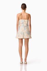 Brunette model wearing Nia Embroidered Mini Dress in Beige back Shot