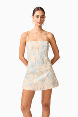 Brunette model wearing Nia Embroidered Mini Dress in Beige close up Shot