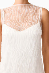 Brunette model wearing the Margot Party Shift Mini Dress in White detail shot