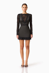 Brunette model wearing the Margot Long Sleeve Mini Dress in Black Front shot