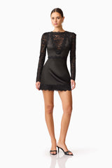 Brunette model wearing the Margot Long Sleeve Mini Dress in Black Posed shot
