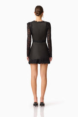 Brunette model wearing the Margot Long Sleeve Mini Dress in Black Back shot