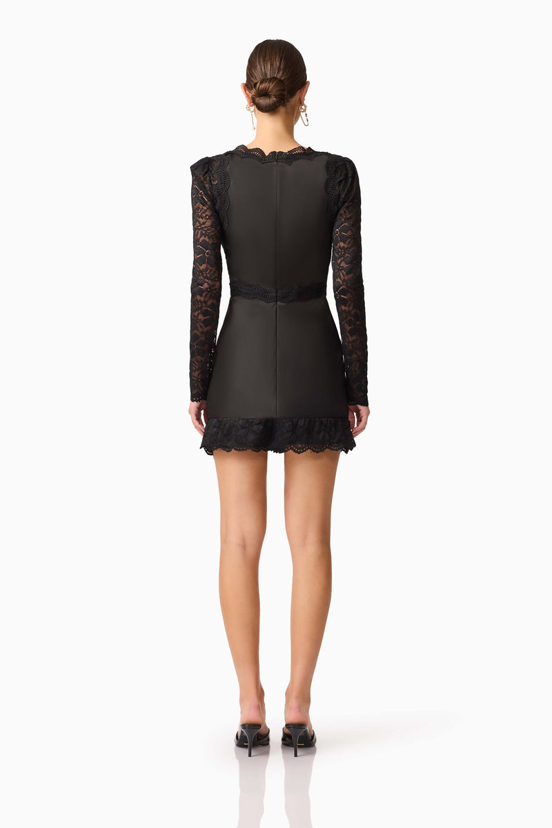 Brunette model wearing the Margot Long Sleeve Mini Dress in Black Back shot