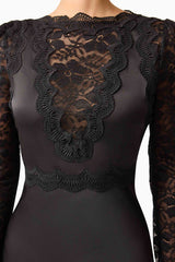 Brunette model wearing the Margot Long Sleeve Mini Dress in Black Detail shot