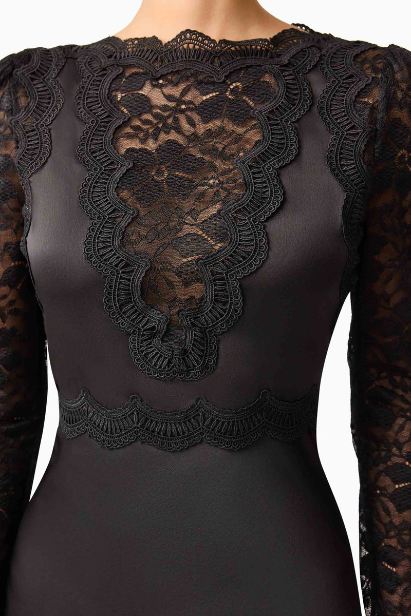 Brunette model wearing the Margot Long Sleeve Mini Dress in Black Detail shot