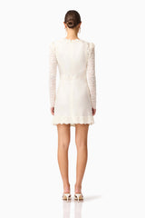 Brunette model wearing the Margot Long Sleeve Mini Dress in White back shot