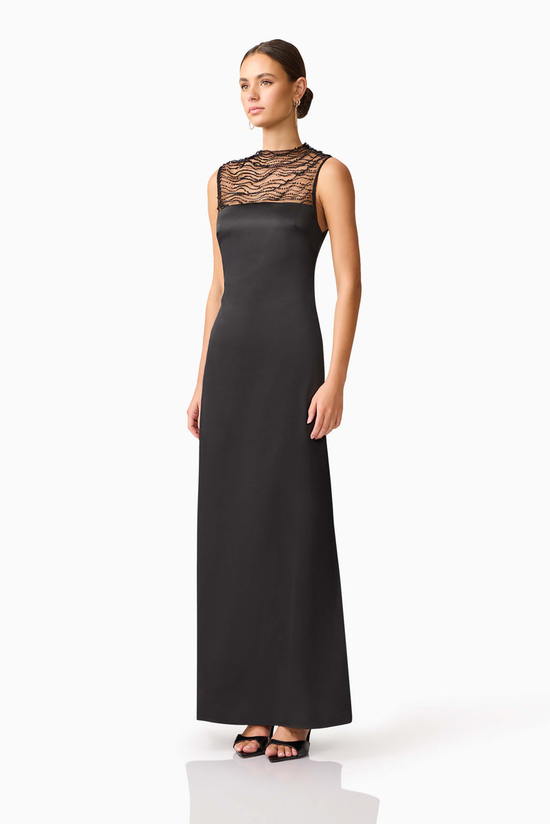 Brunette model wearing the Margot Satin Gown in Black side shot