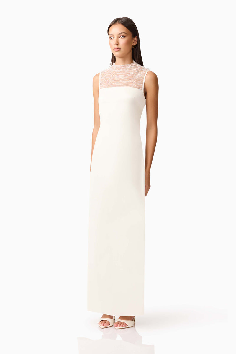 Brunette model wearing the Margot Satin Gown in White side shot