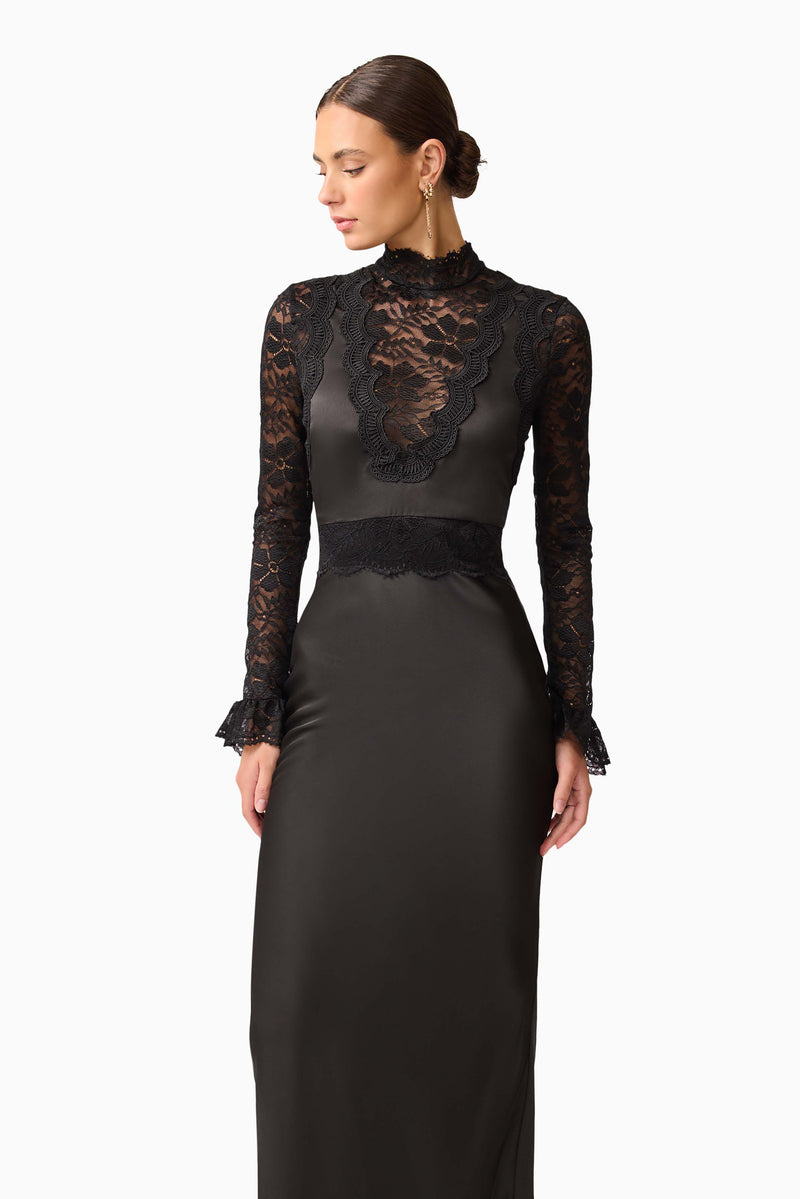 Brunette model wearing the Margot Long Sleeve Gown in Black close up shot