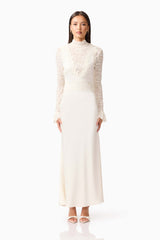 Brunette model wearing the Margot Long Sleeve Gown in White front shot