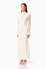 Brunette model wearing the Margot Long Sleeve Gown in White side shot