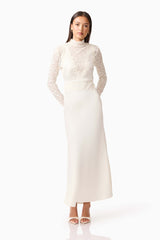 Brunette model wearing the Margot Long Sleeve Gown in White posed shot