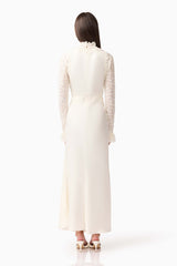 Brunette model wearing the Margot Long Sleeve Gown in White back shot