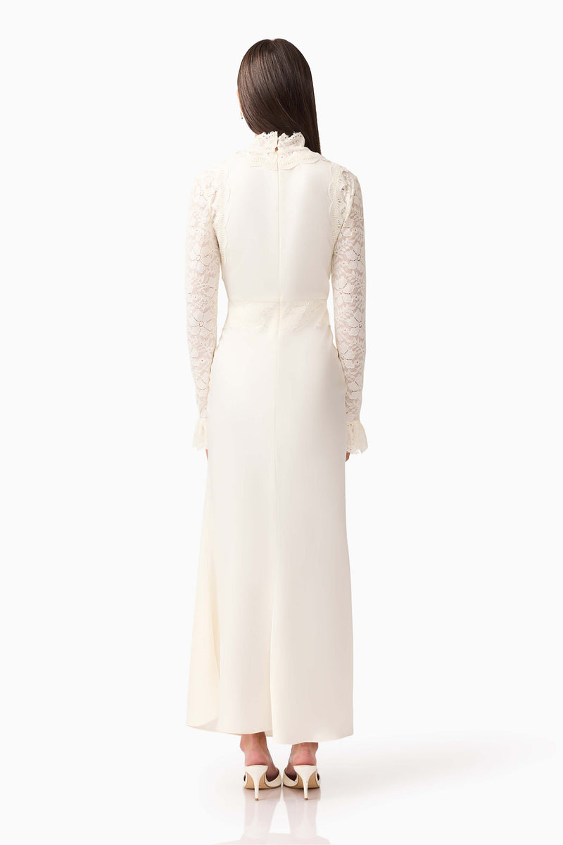 Brunette model wearing the Margot Long Sleeve Gown in White back shot