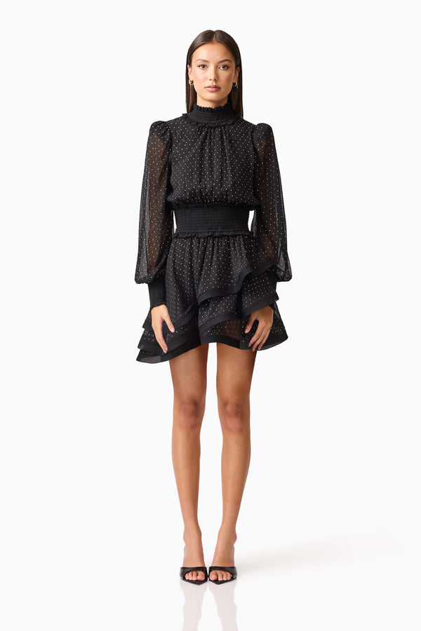 Brunette model wearing the Moss Long Sleeve Mini Dress in Black front shot