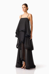 Brunette model wearing Moss Tiered Gown in Black side shot