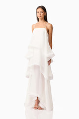 Brunette model wearing Moss Tiered Gown in White side shot