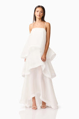 Brunette model wearing Moss Tiered Gown in White posed shot