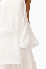 Brunette model wearing Moss Tiered Gown in White detail shot
