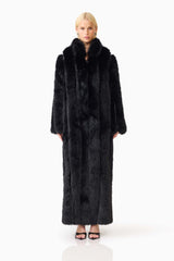 Blonde model wearing the Lux Faux Fur Coat in Black front shot