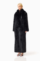 Blonde model wearing the Lux Faux Fur Coat in Black side shot