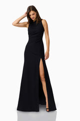 Valessa Asymmetrical Gown in Black with asymmetrical tuck neckline &  sleeveless silhouette posed looking down shot