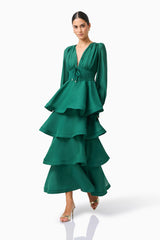 Eloria Tiered Maxi Dress in Forest Green with long sleeves & v-neckline posed leaning shot