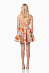 blonde model wearing Discotheque 3D floral mini dress in multi back shot