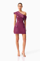 Brunette model wearing the Nova Off The Shoulder Mini Dress in Purple posed shot 