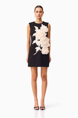 Brunette model wearing the Zahara Shift Mini Dress in Black front shot