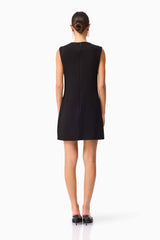 Brunette model wearing the Zahara Shift Mini Dress in Black back shot