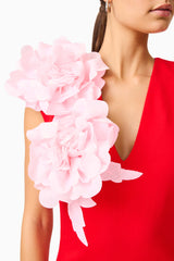 Brunette model wearing the Zahara V-Neck Gown in Red & Pink detail shot