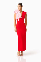 Brunette model wearing the Zahara V-Neck Gown in Red & Pink posed looking away shot