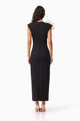 Brunette model wearing the Zahara V-Neck Gown in Black back shot