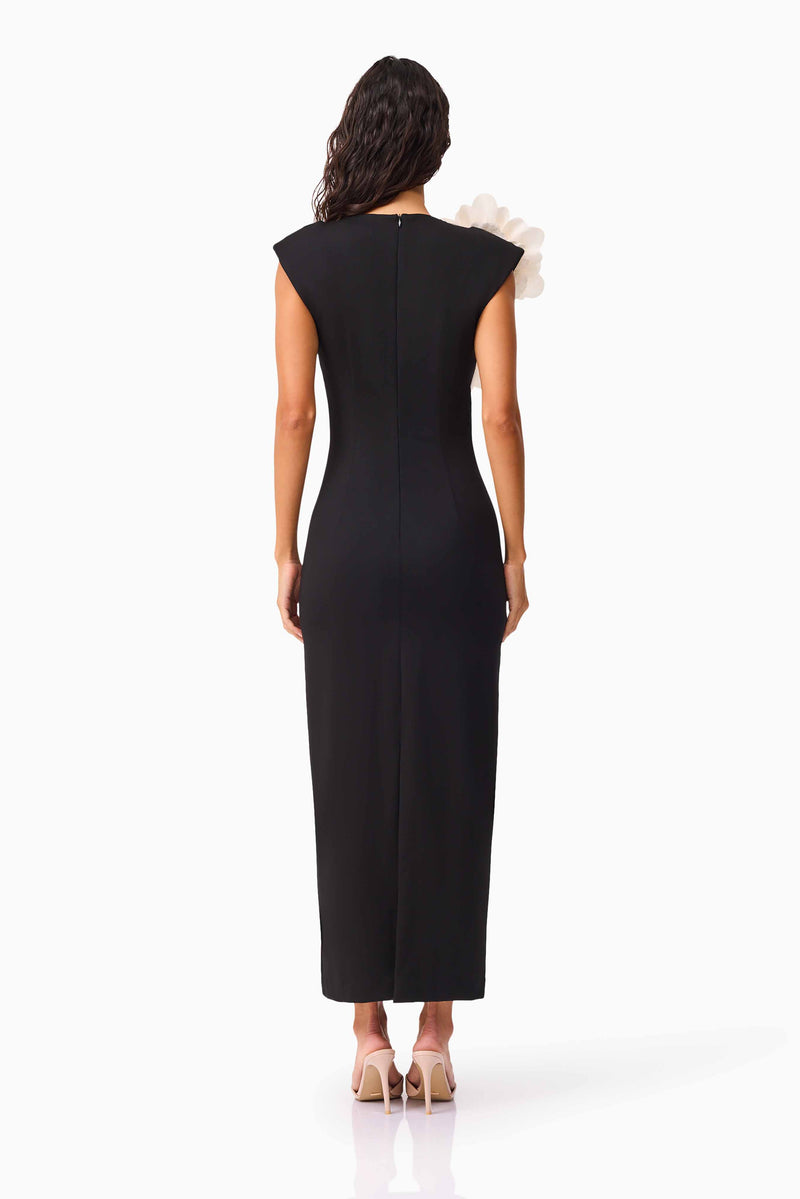 Brunette model wearing the Zahara V-Neck Gown in Black back shot