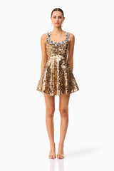 Brunette model wearing the Noelle Sequin Mini Dress in Gold front shot