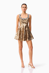 Brunette model wearing the Noelle Sequin Mini Dress in Gold posed shot