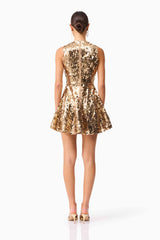 Brunette model wearing the Noelle Sequin Mini Dress in Gold back shot