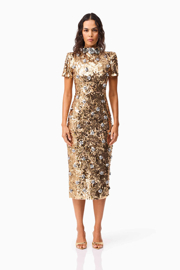Brunette model wearing the Noelle Sequin Short Sleeve Midi Dress in Gold front shot
