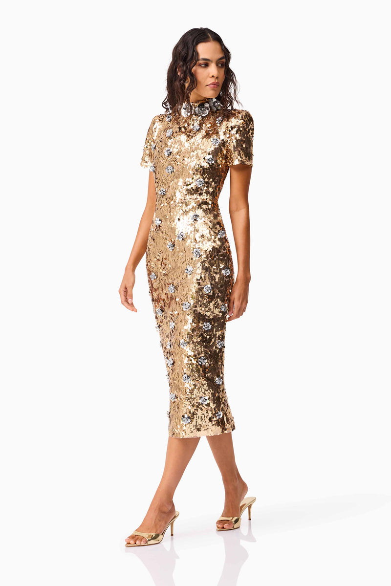 Brunette model wearing the Noelle Sequin Short Sleeve Midi Dress in Gold posed shot