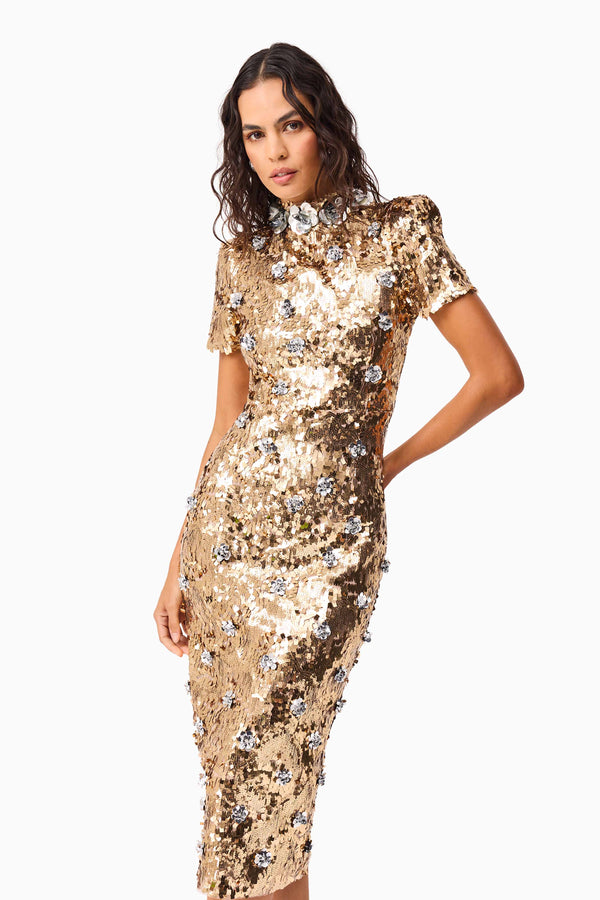 Brunette model wearing the Noelle Sequin Short Sleeve Midi Dress in Gold close up shot 2