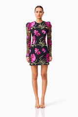 Brunette model wearing the Amaya Long Sleeve Mini Dress in Black & Pink Floral front shot