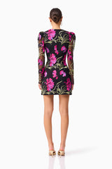 Brunette model wearing the Amaya Long Sleeve Mini Dress in Black & Pink Floral back shot