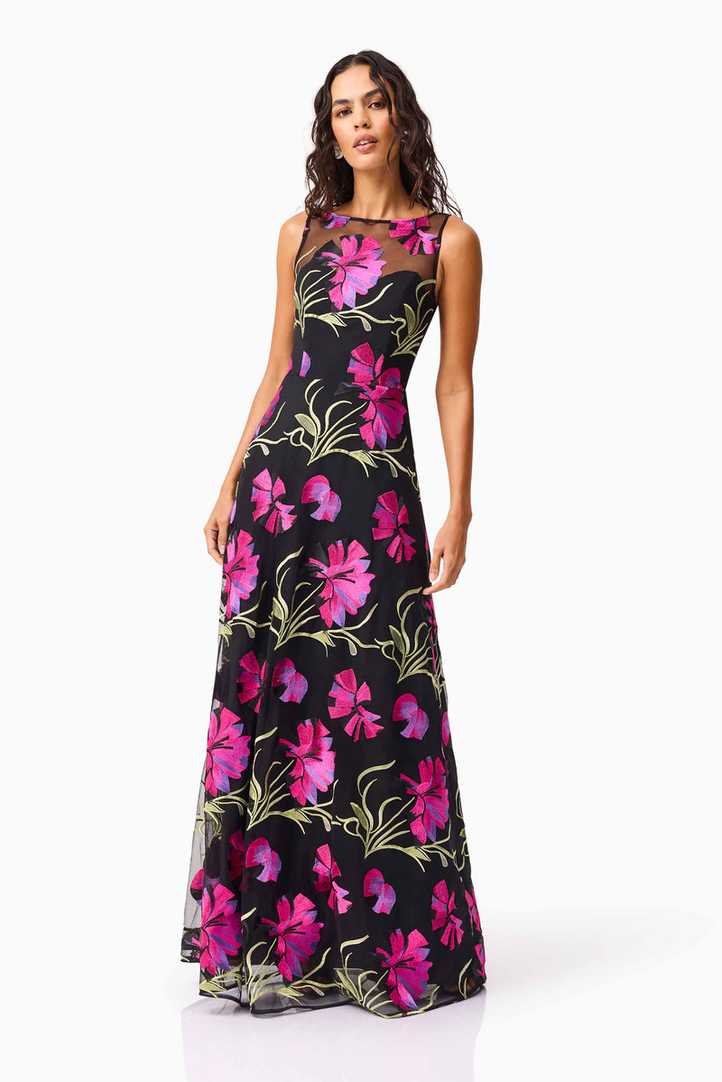 Brunette model wearing the Amaya Gown in Black & Pink Floral posed shot