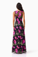 Brunette model wearing the Amaya Gown in Black & Pink Floral back shot