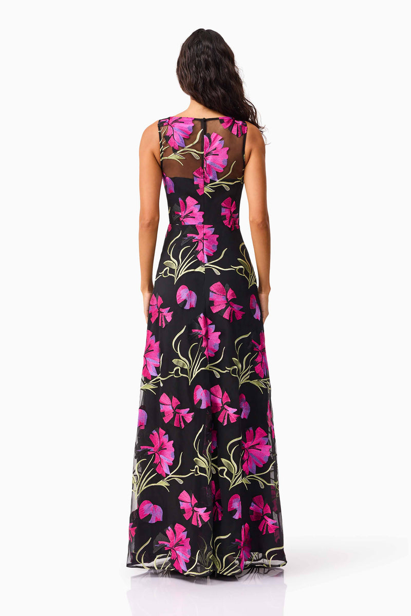 Brunette model wearing the Amaya Gown in Black & Pink Floral back shot
