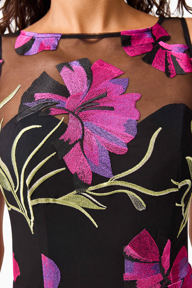 Brunette model wearing the Amaya Gown in Black & Pink Floral detail shot