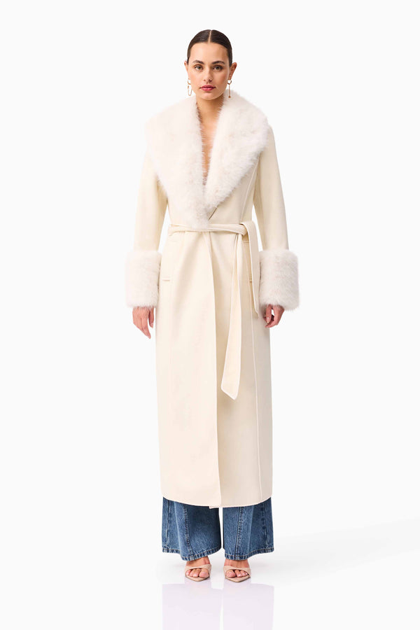 Brunette model wearing the Aria Coat in Cream front shot