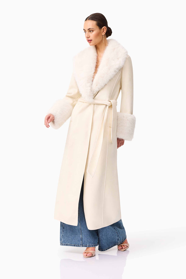 Brunette model wearing the Aria Coat in Cream posed shot