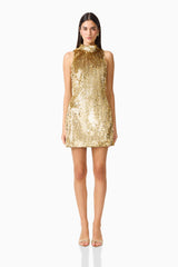 Model wearing Mercelline Embellished Mini Dress in Gold with high neckline & sequin fabrication front shot
